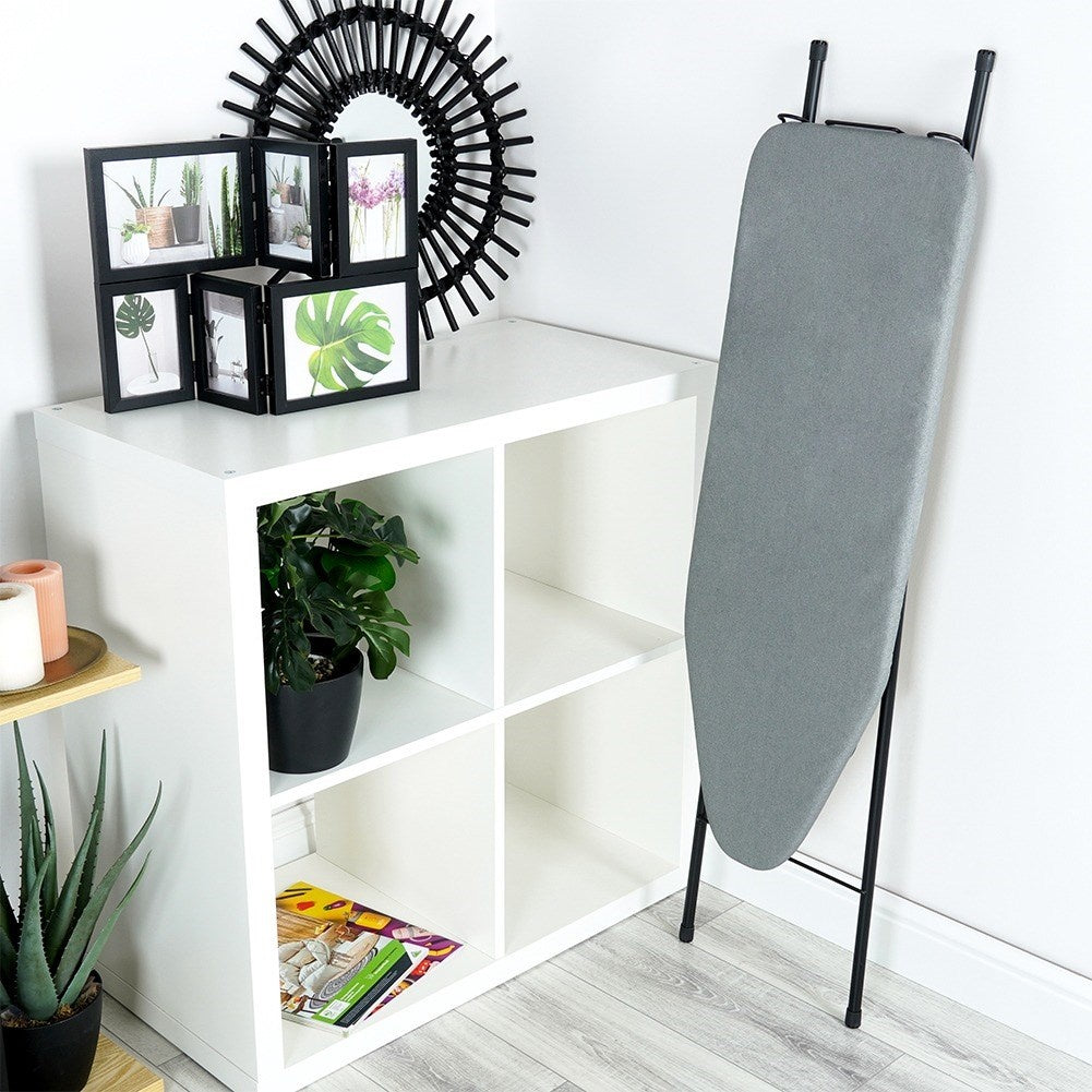 Comfortable, stable ironing board with iron holder