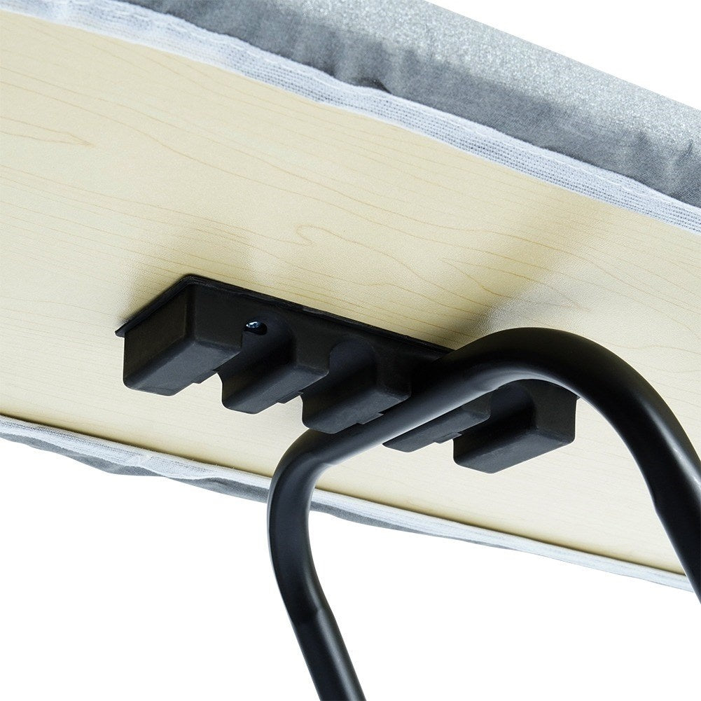 Comfortable, stable ironing board with iron holder