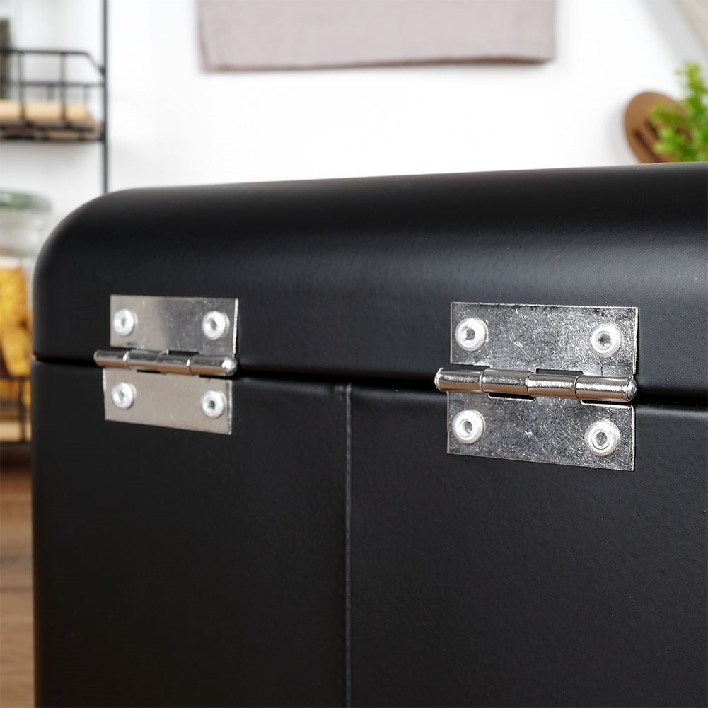 Compact black metal bread box with hinged lid