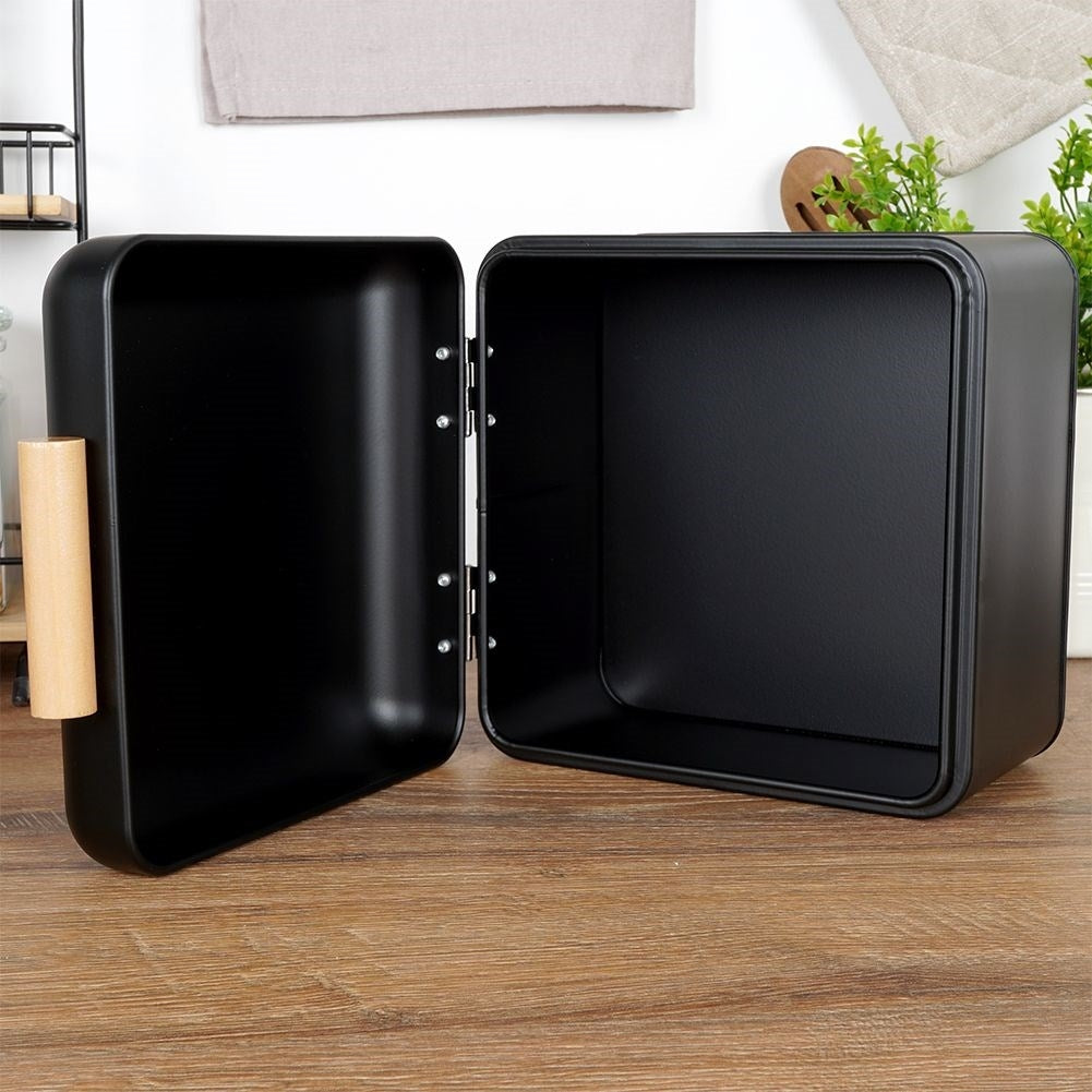 Compact black metal bread box with hinged lid
