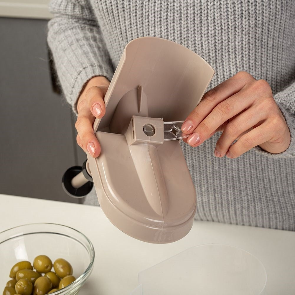 Core remover with suction cup and removable container