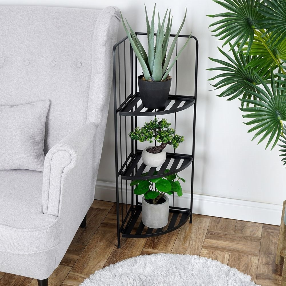 Corner shelf in black metal for flowers and herbs