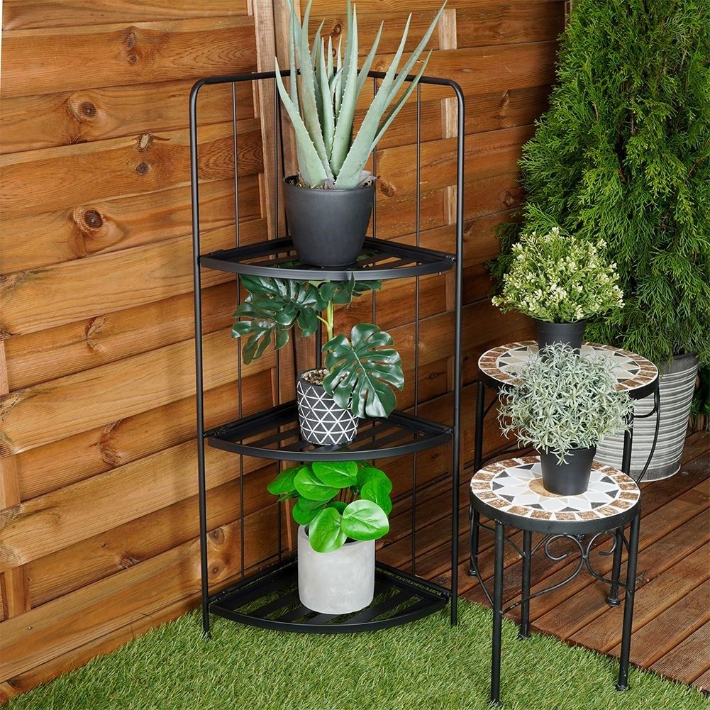Corner shelf in black metal for flowers and herbs