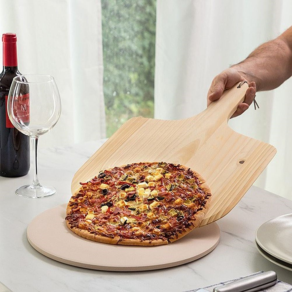 Crispy pizza with chamotte pizza stone and wooden board