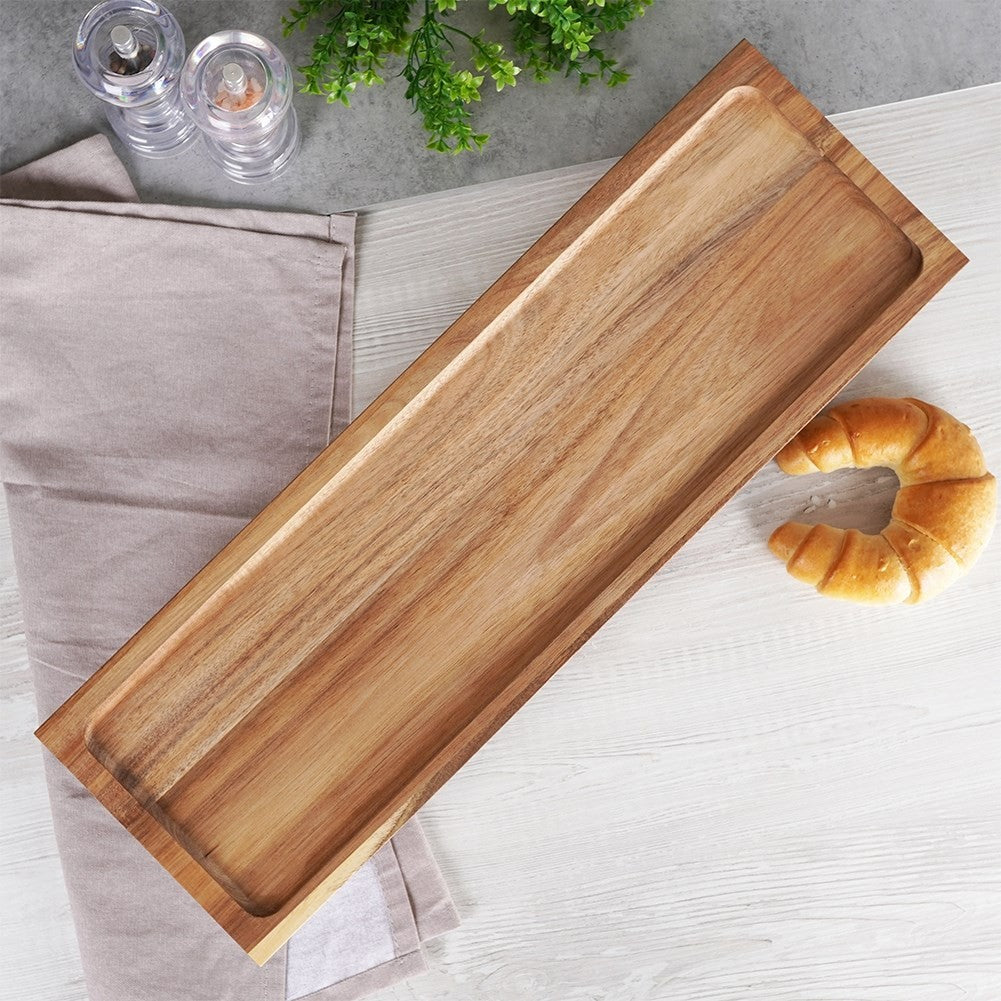 Cutting board made of acacia wood on high legs for serving