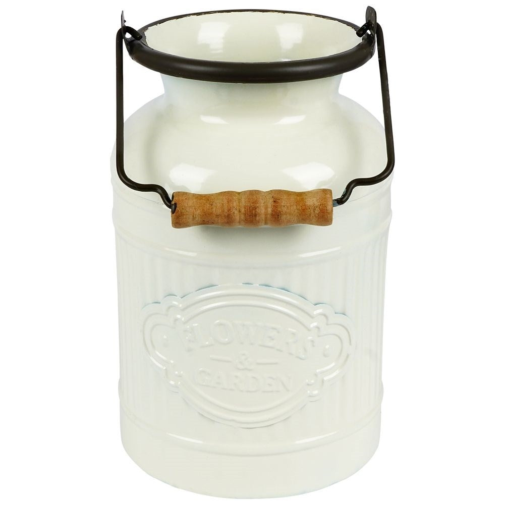 Decorative beige metal jug in retro style for home and garden