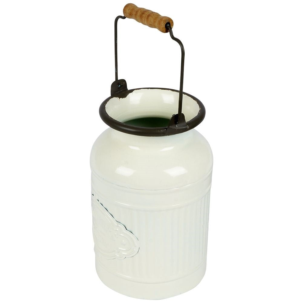 Decorative beige metal jug in retro style for home and garden