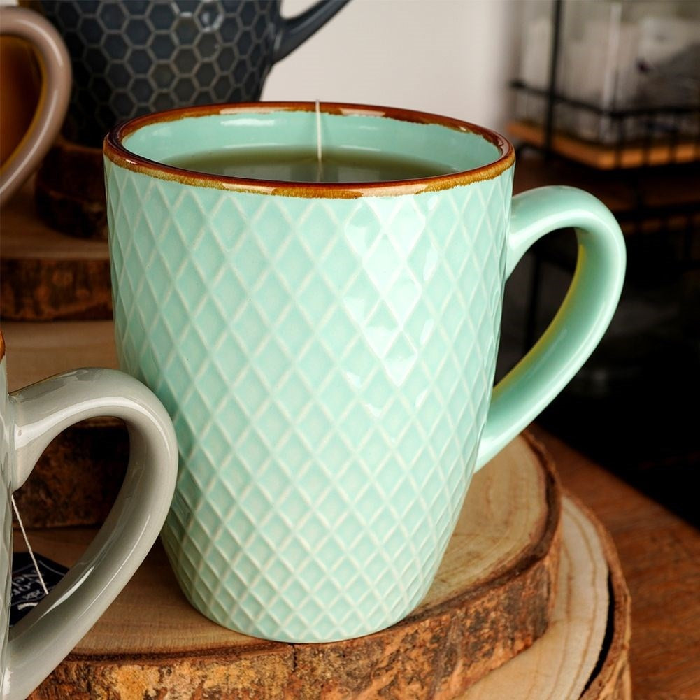 Decorative ceramic cups in a gift box for drinks