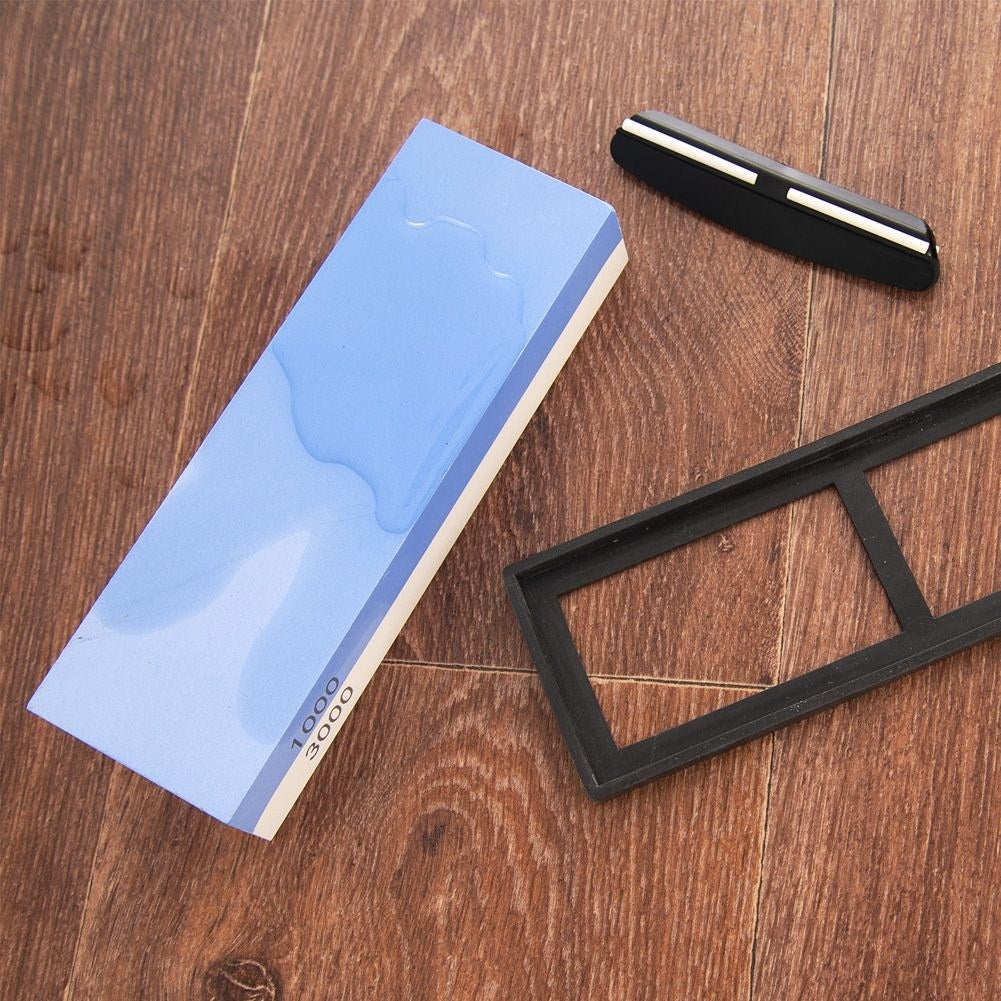 Double-sided whetstone with guide for knives and tools