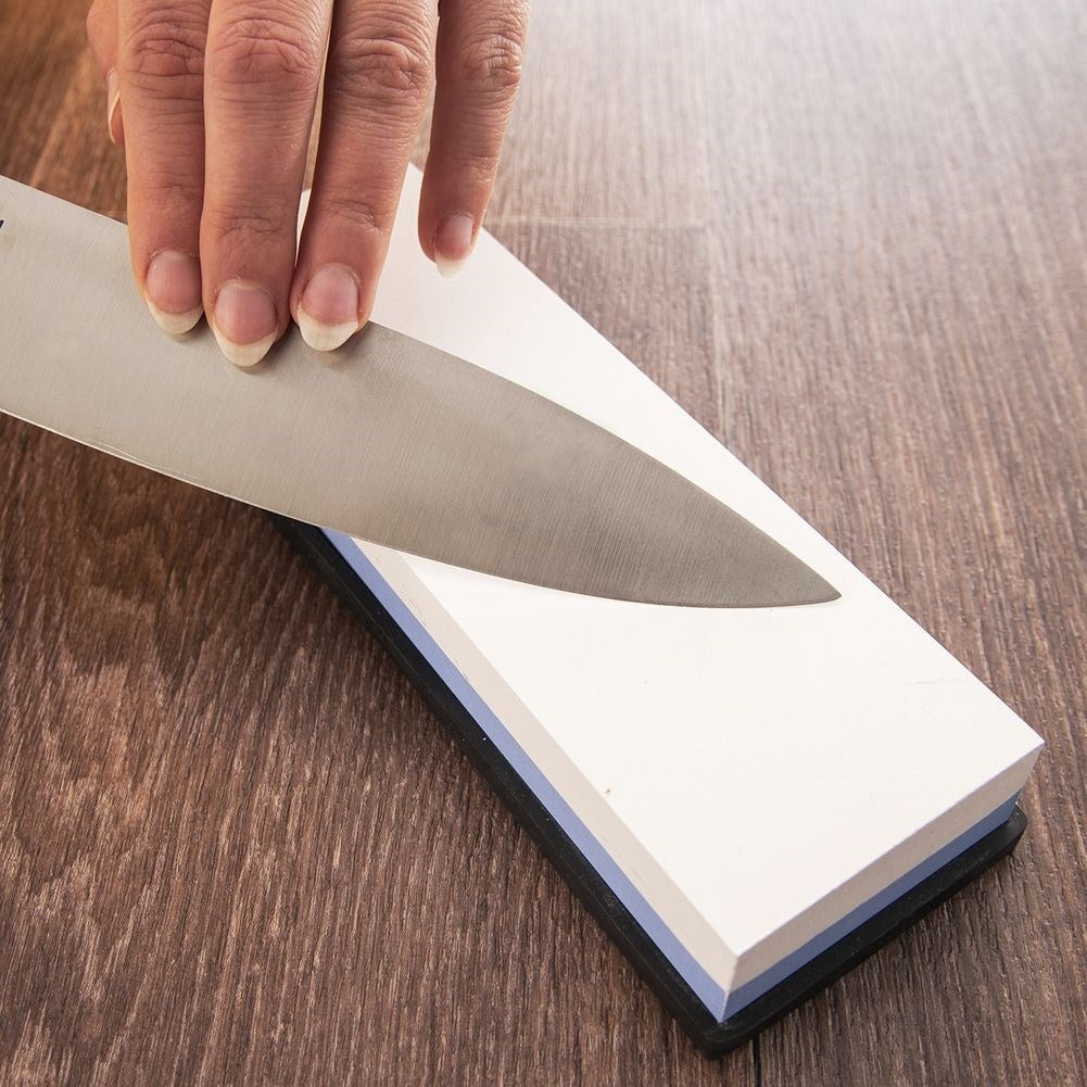Double-sided whetstone with guide for knives and tools