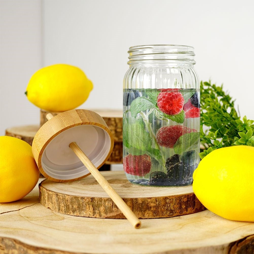 Drinking jar in thick glass with elegant stripes and bamboo straw