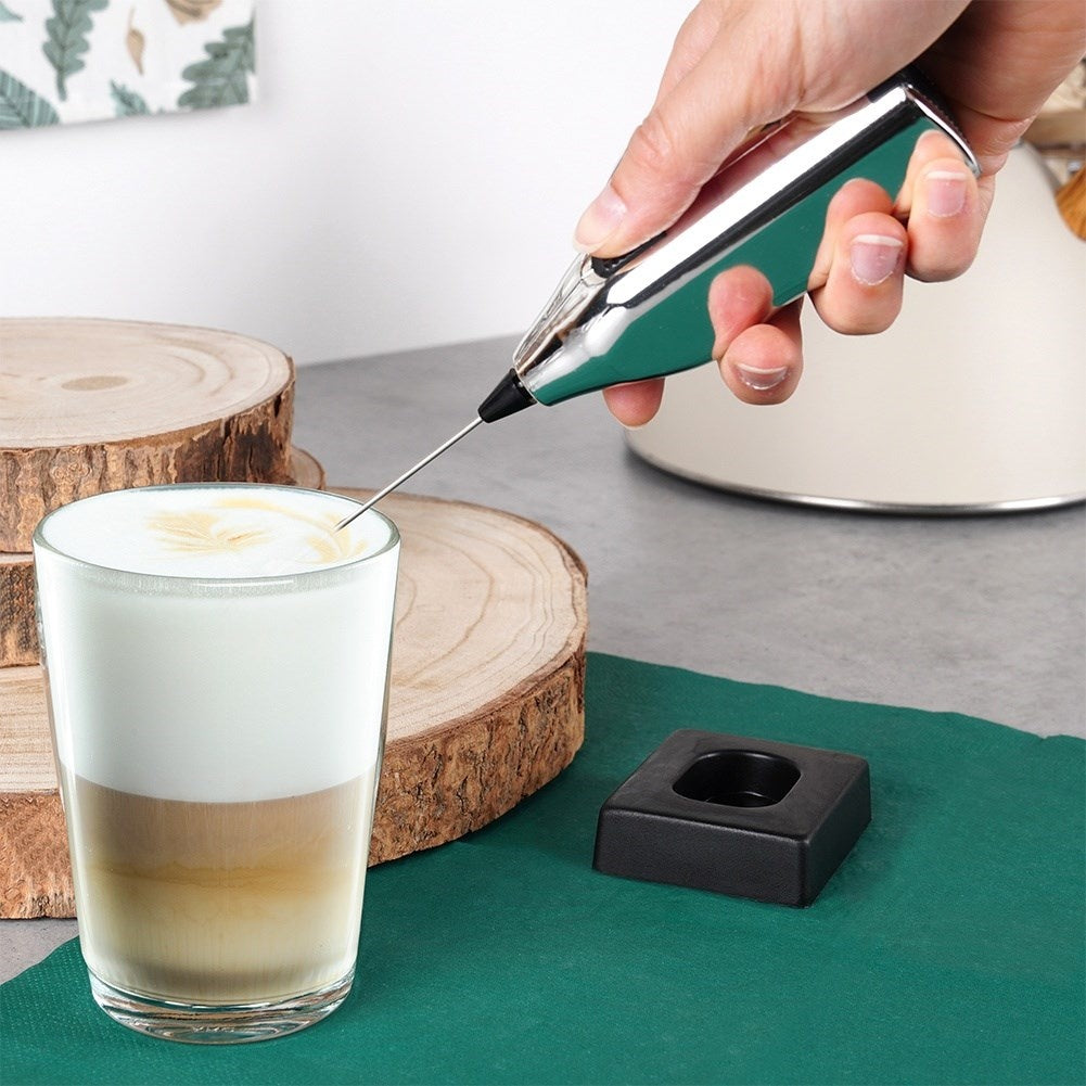 Electric milk frother with stand, battery powered