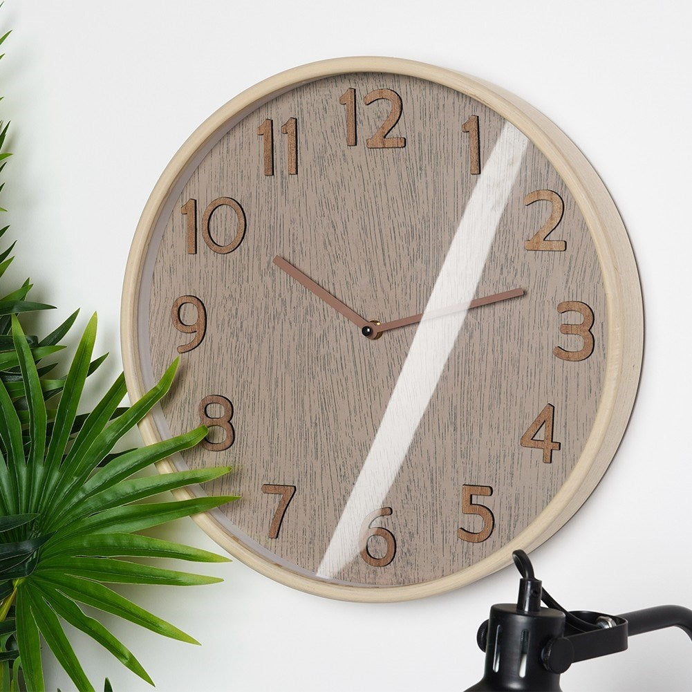 Elegant Wall Clock 38 cm with Wooden FinishThis wall clock has a diameter of 38 cm and is designed in a classic style. The frame of the watch is made of MDF, while the dial and hands have a wood-like finish. Perfect for giving your home a timeless and