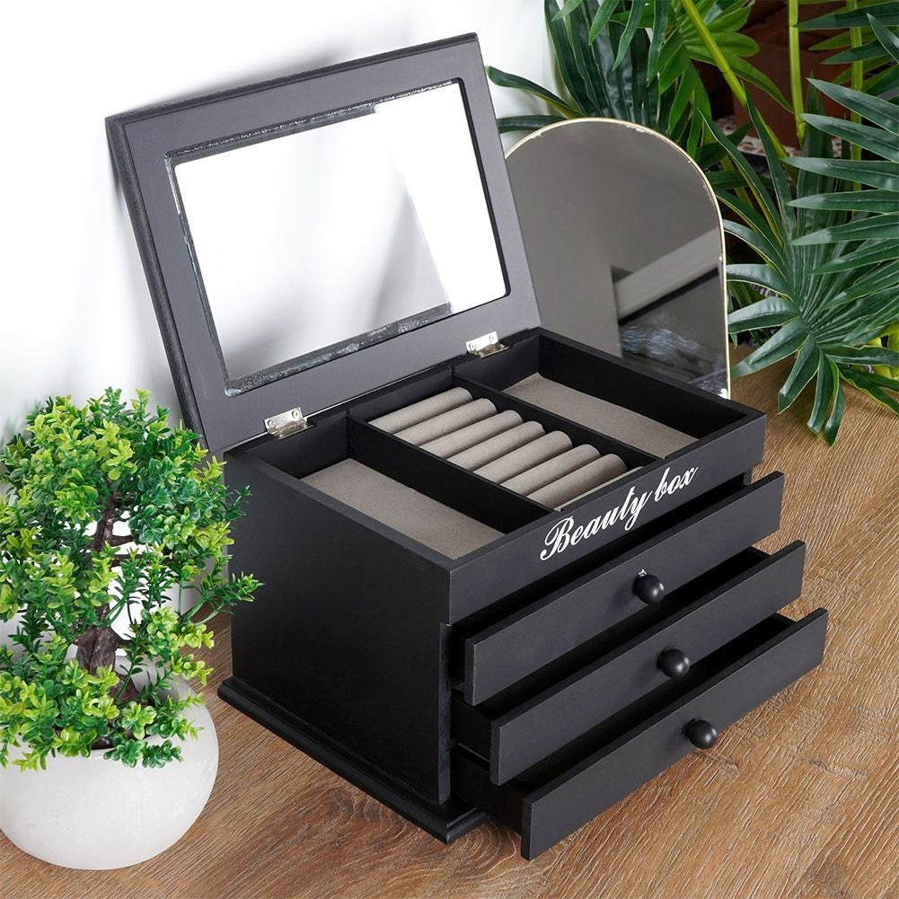 Elegant black jewelry box with glass lid and three drawers