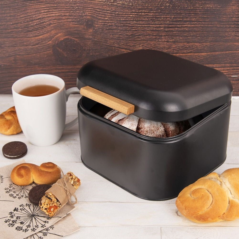 Elegant black metal bread box with bamboo handle