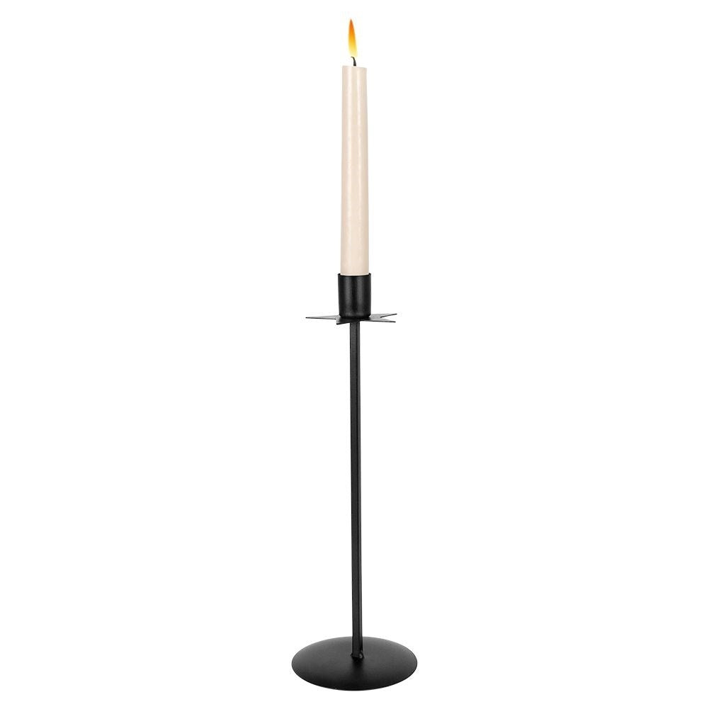 Elegant black metal candlestick with decorative star