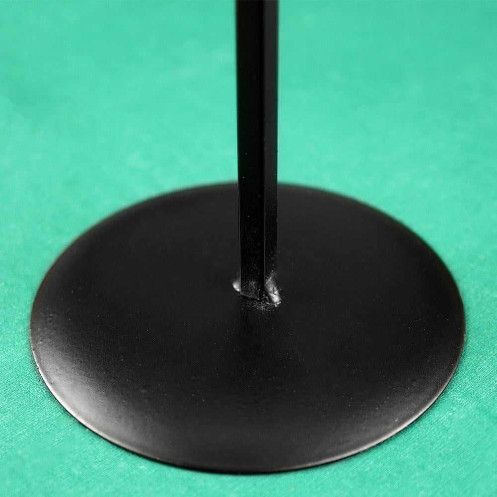 Elegant black metal candlestick with decorative star