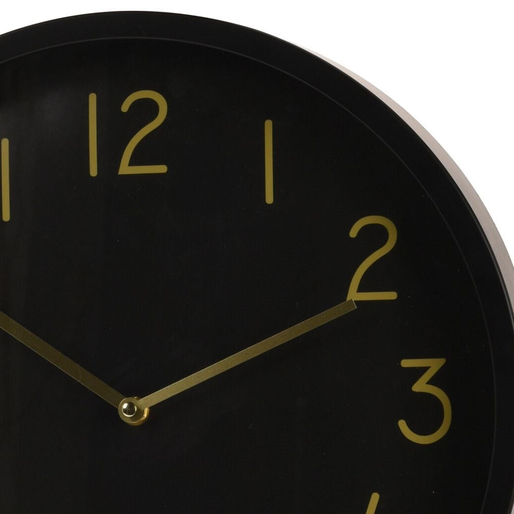 Elegant black wall clock with golden hands and numbers