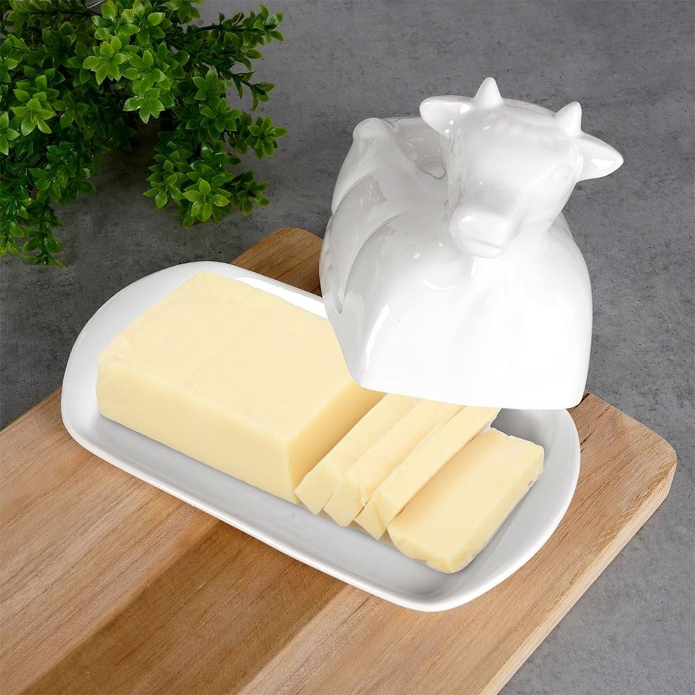 Elegant butter dish in the shape of a cow, white porcelain, with lid