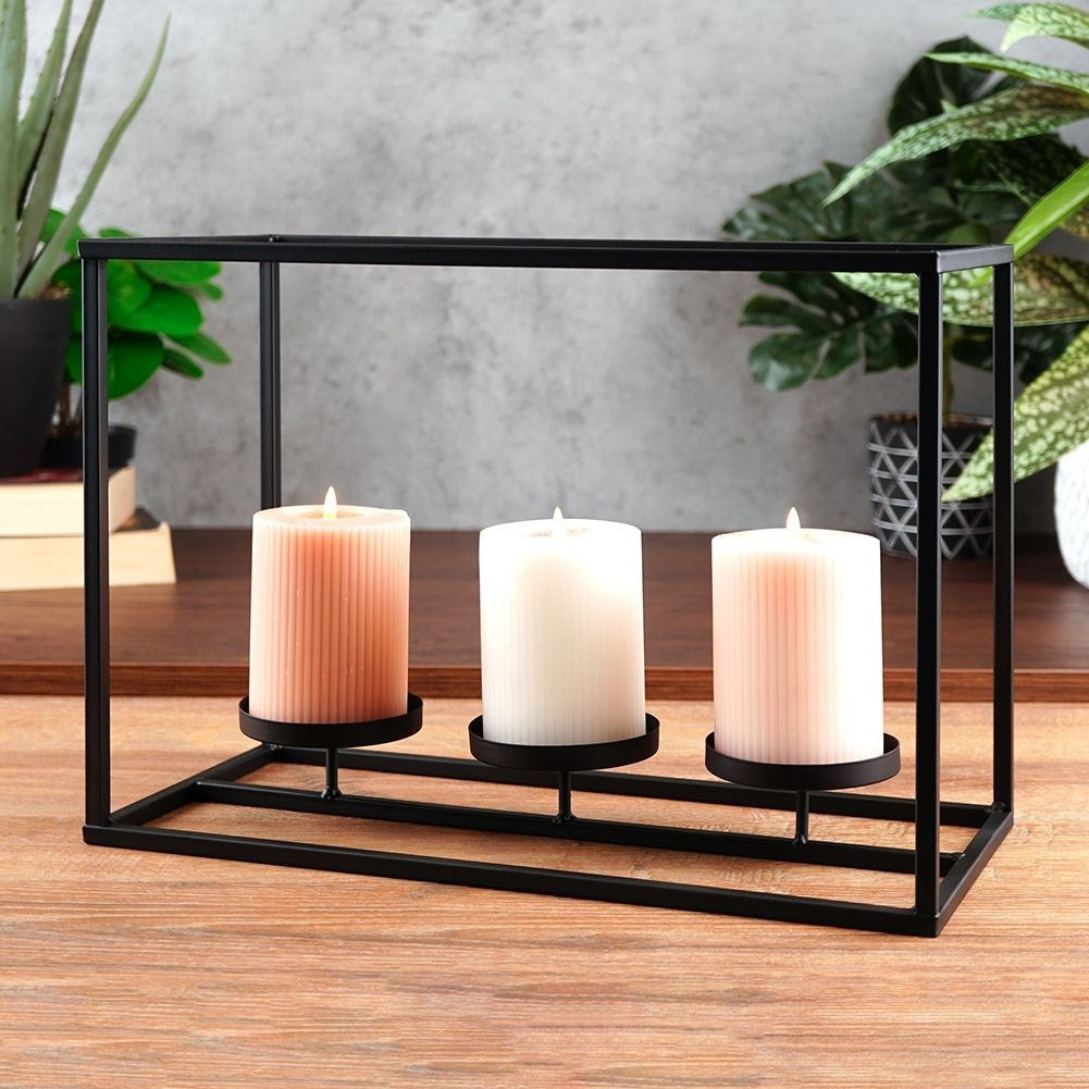 Elegant candlestick for candles and tealights in black metal