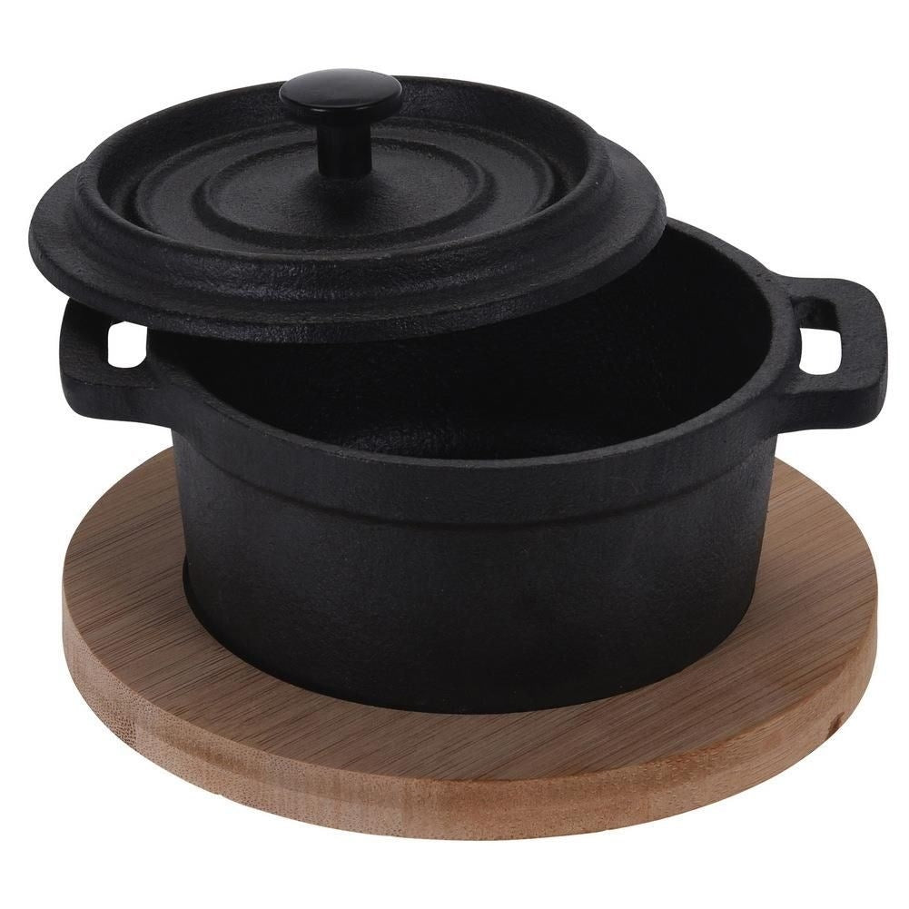 Elegant cast iron pot with lid and wooden board