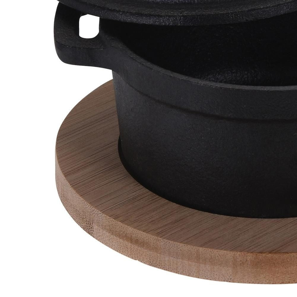 Elegant cast iron pot with lid and wooden board