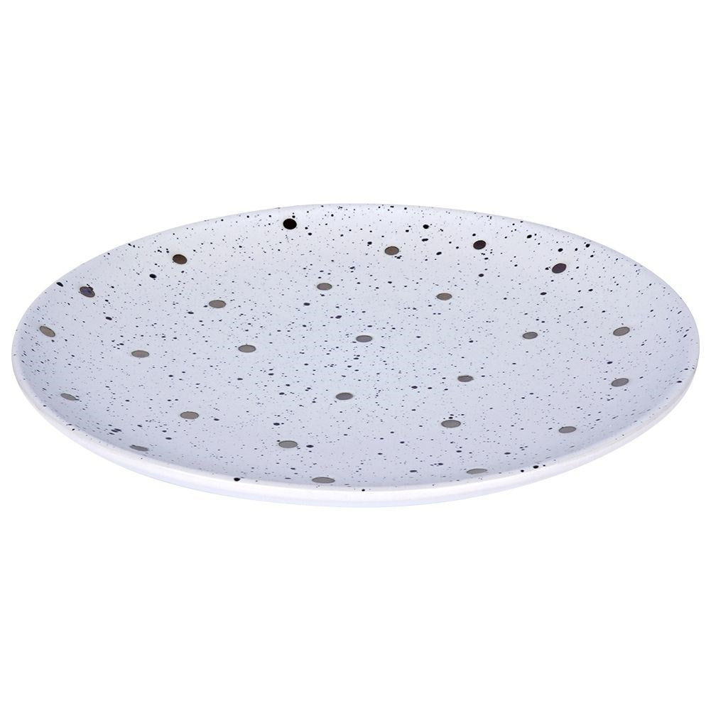 Elegant ceramic plate with black and gold dots