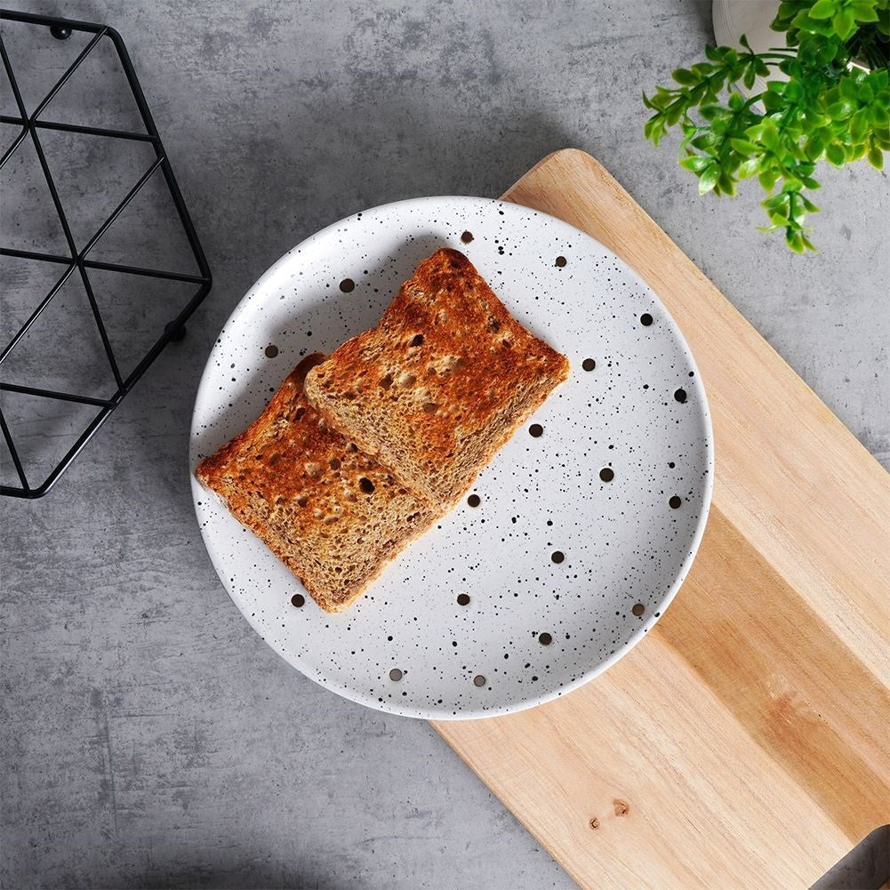 Elegant ceramic plate with black and gold dots