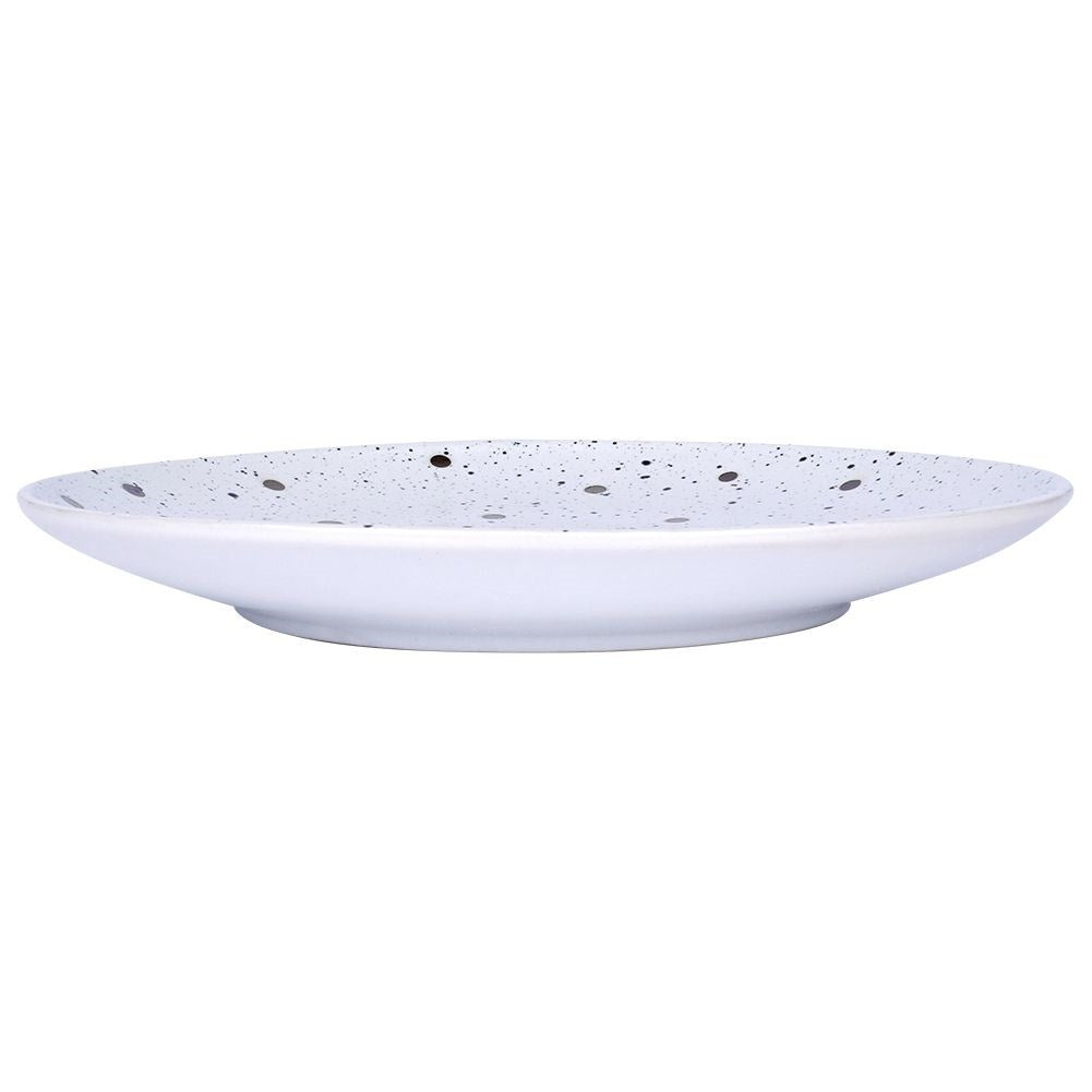 Elegant ceramic plate with black and gold dots