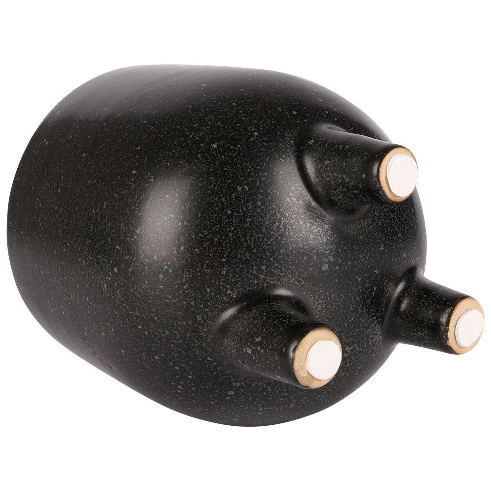 Elegant ceramic pot on legs with black, dotted pattern