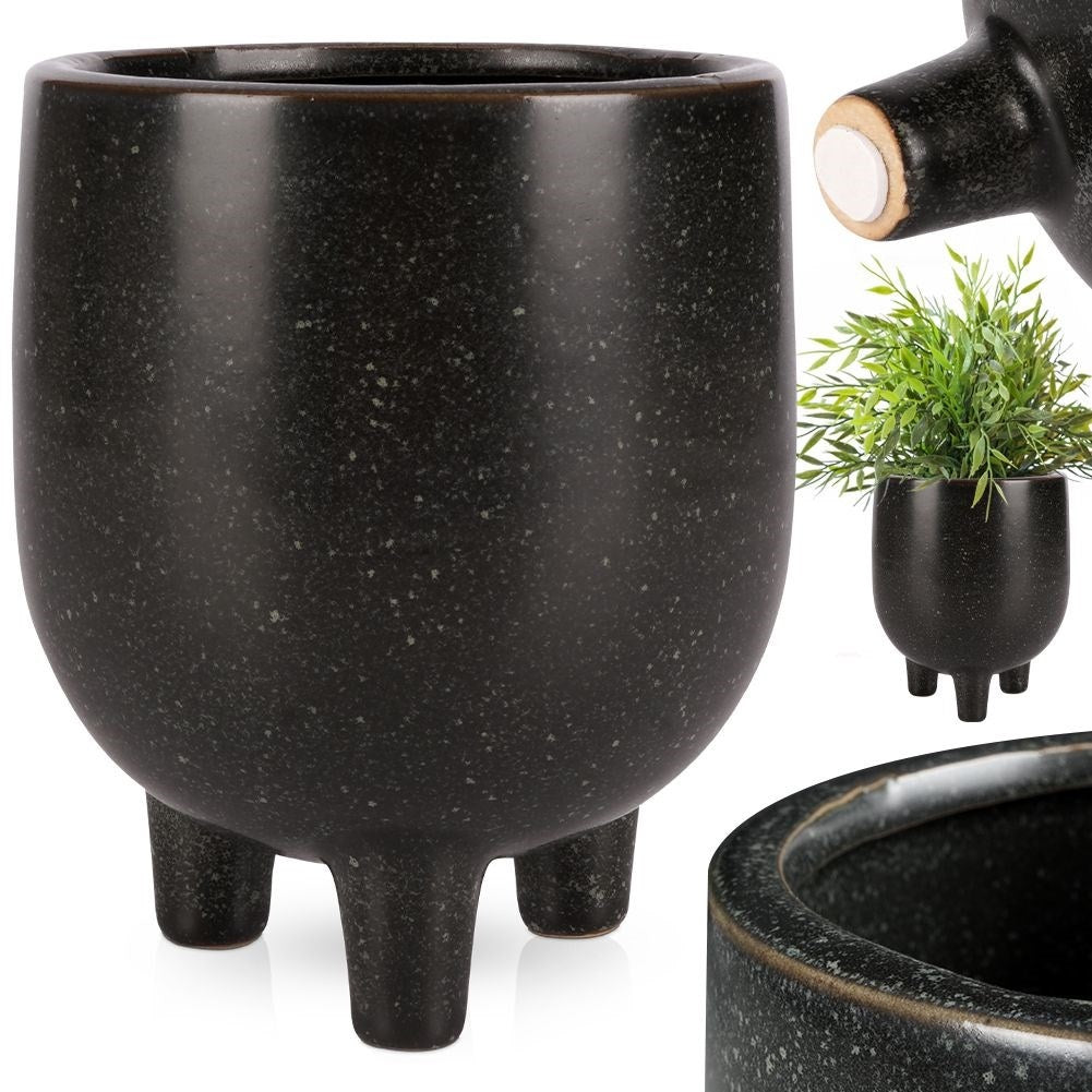 Elegant ceramic pot on legs with black, dotted pattern