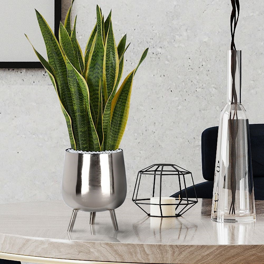 Elegant flower pot on legs in silver for plants