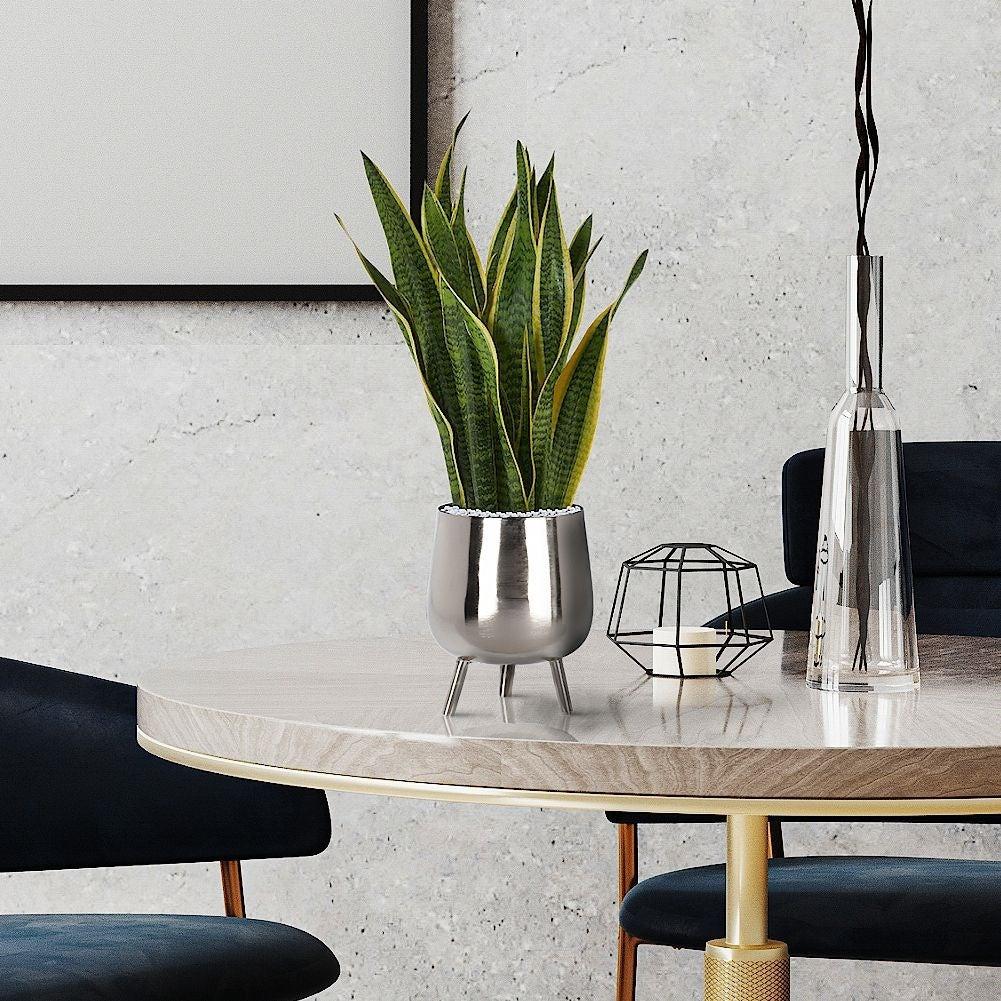 Elegant flower pot on legs in silver for plants