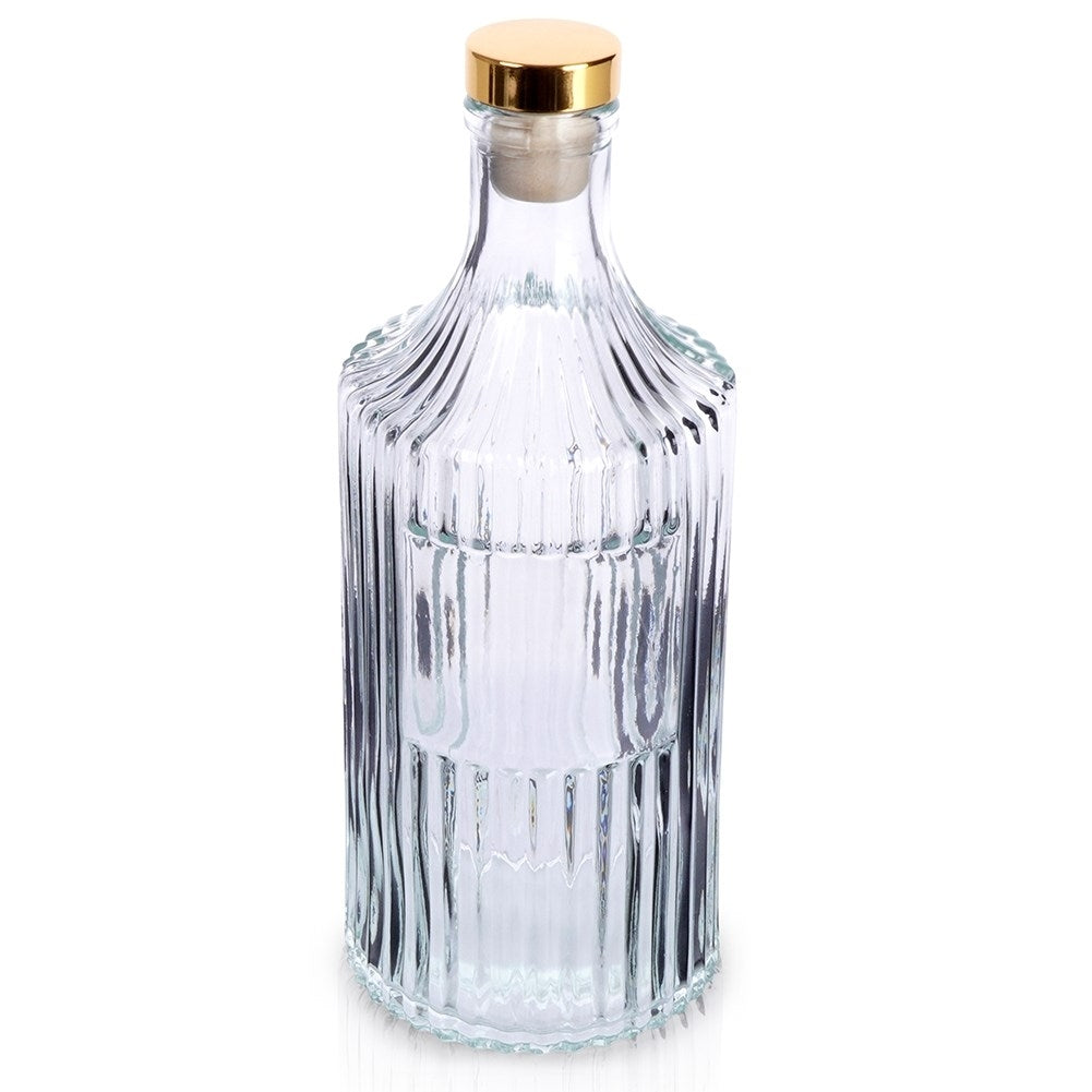 Elegant glass bottle with gold cap for drinks and decoration