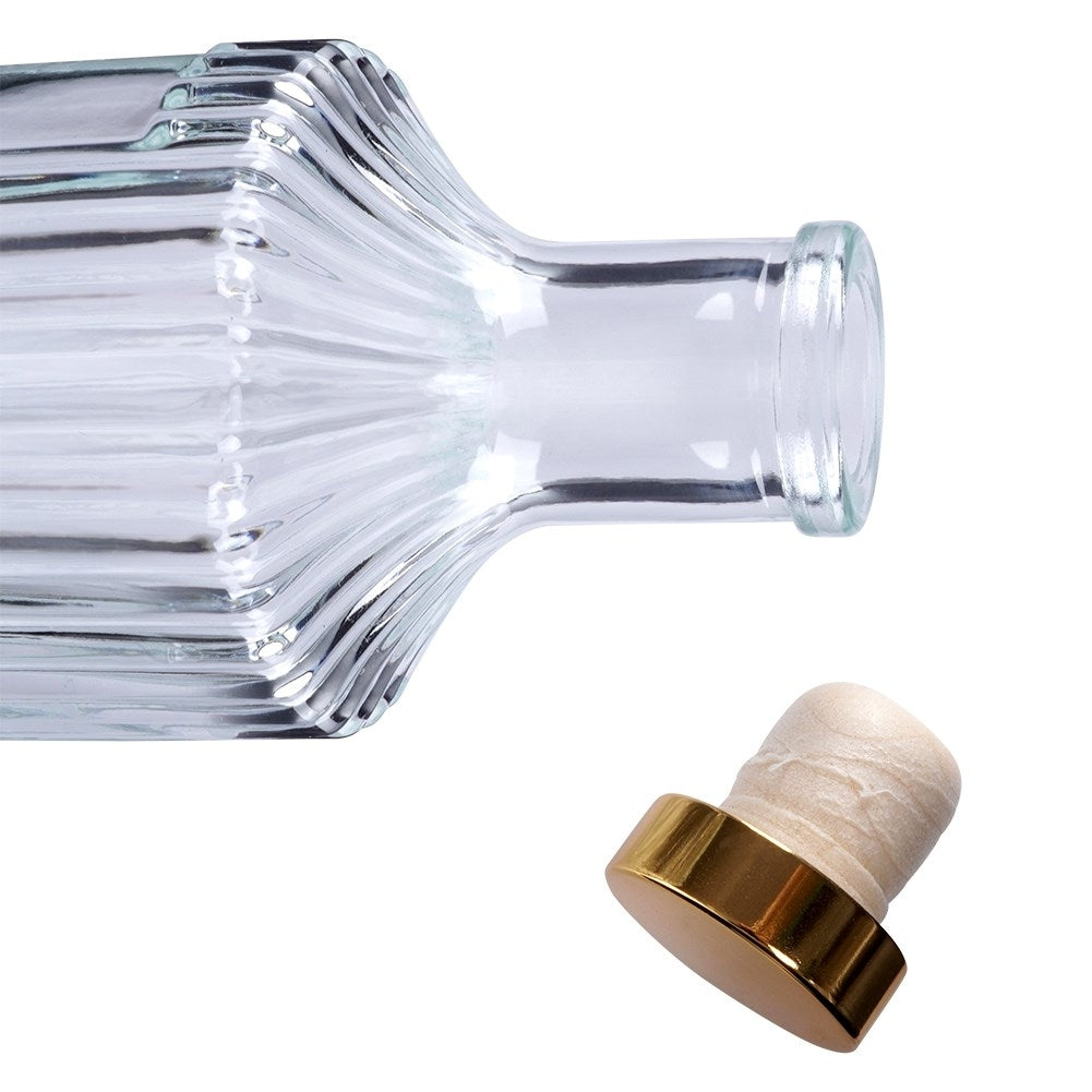 Elegant glass bottle with gold cap for drinks and decoration