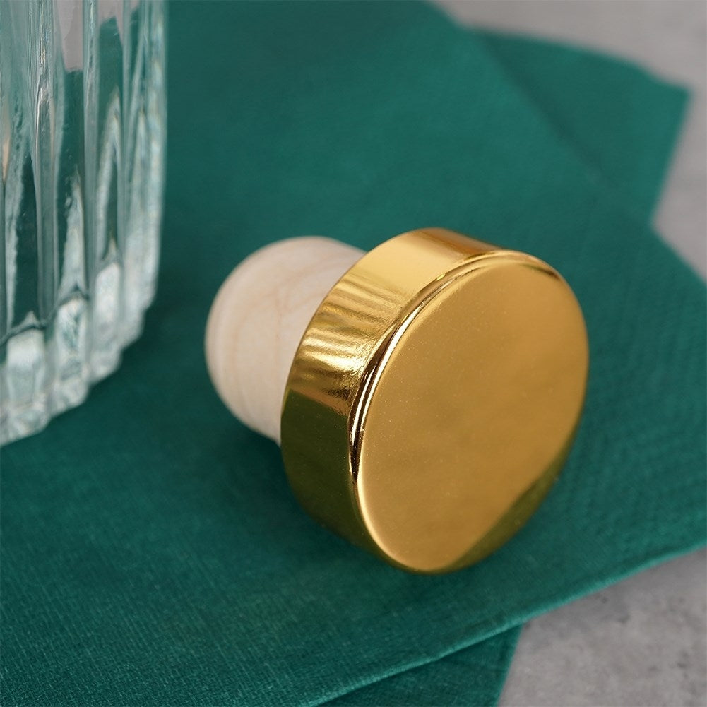 Elegant glass bottle with gold cap for drinks and decoration
