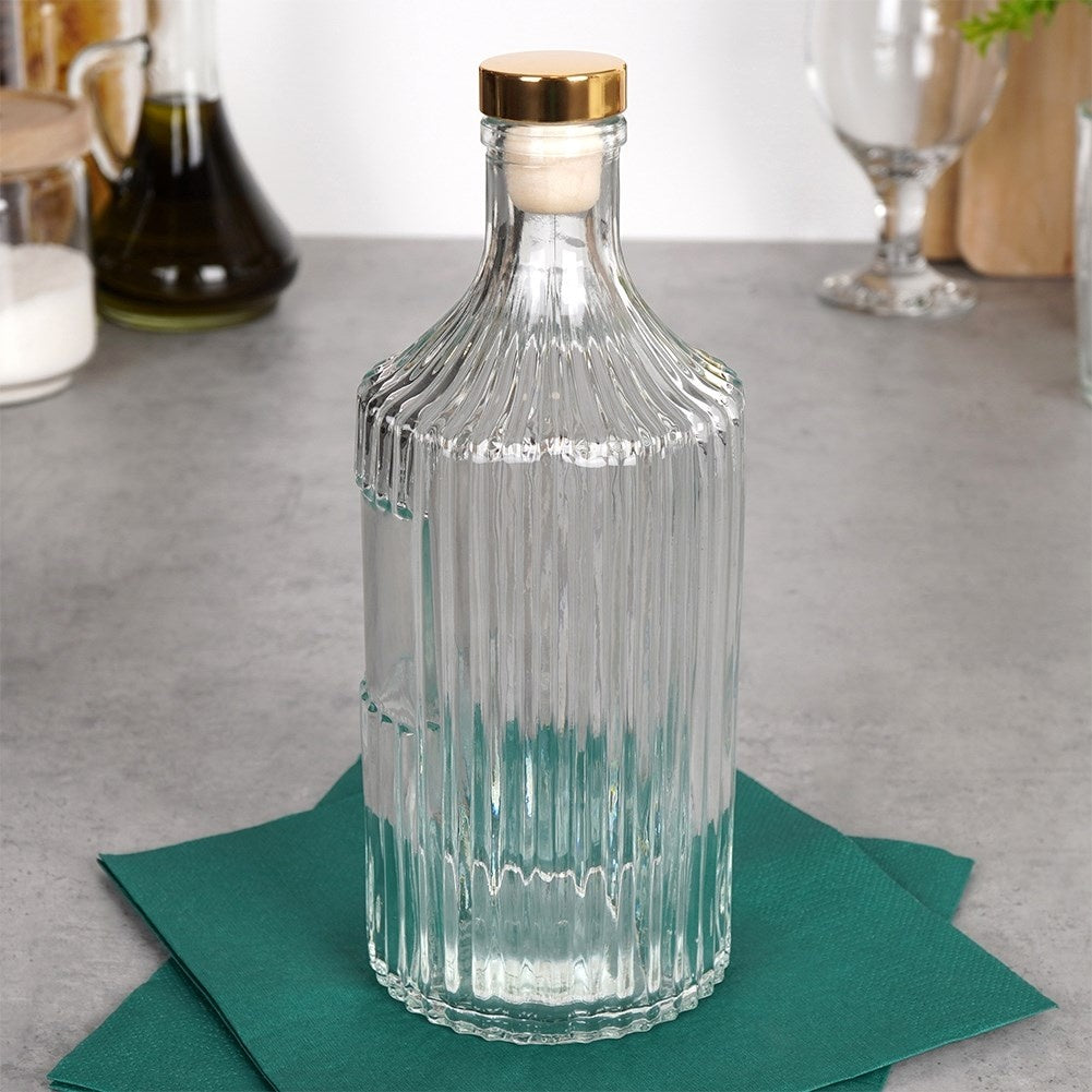 Elegant glass bottle with gold cap for drinks and decoration