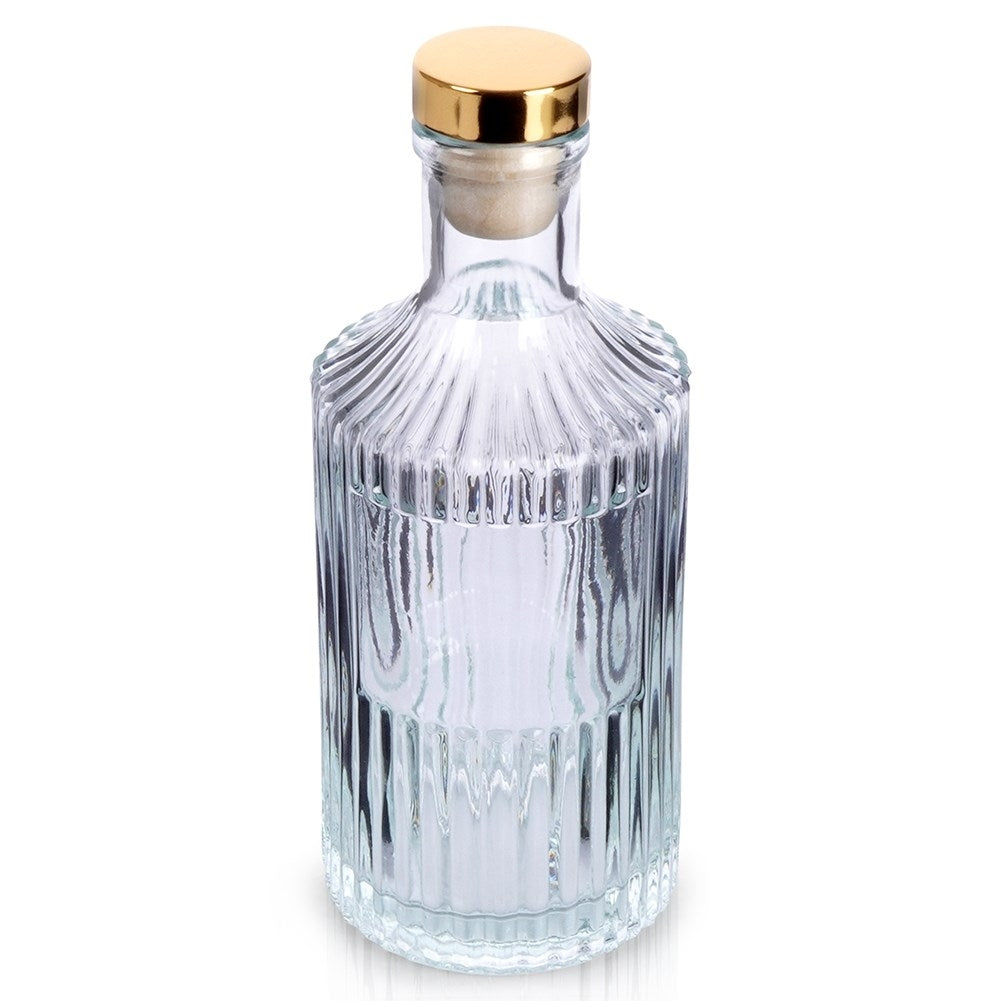 Elegant glass bottle with golden cork for drinks