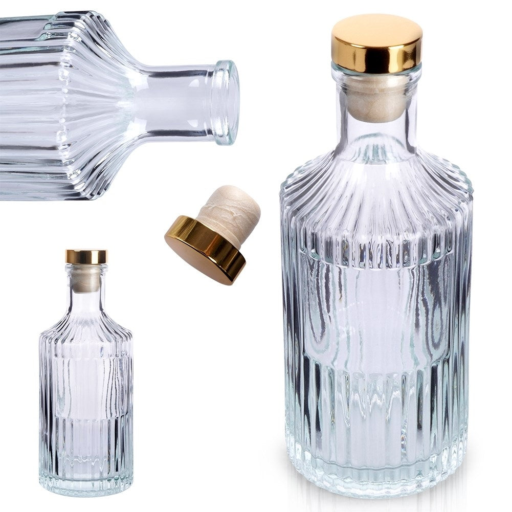 Elegant glass bottle with golden cork for drinks