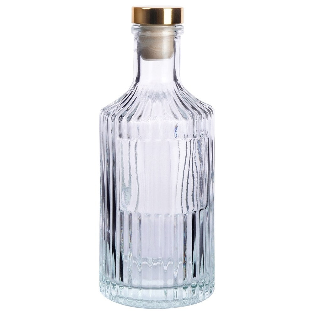 Elegant glass bottle with golden cork for drinks