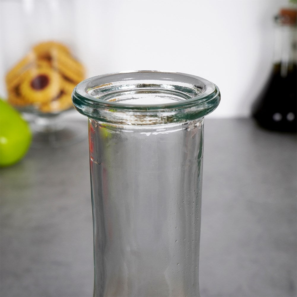 Elegant glass decanter with round cork for drinks and alcohol