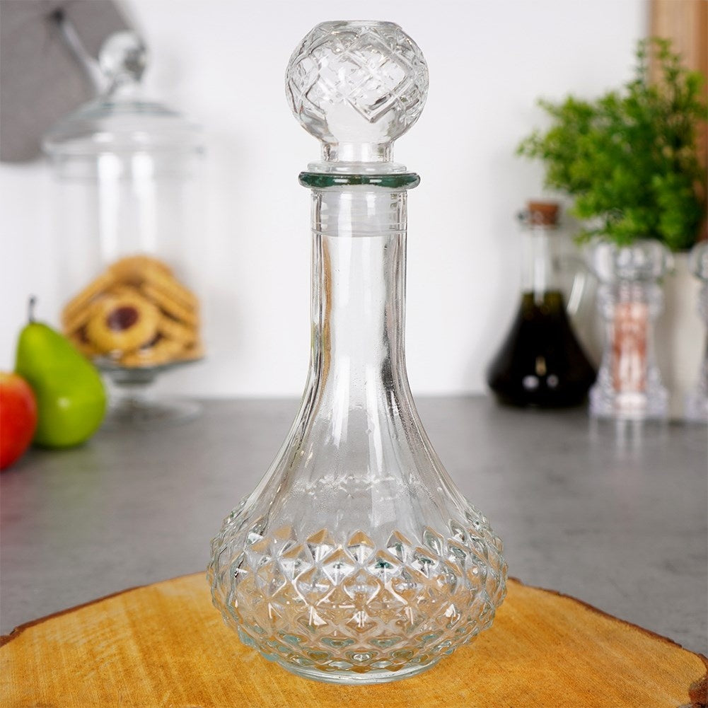 Elegant glass decanter with round cork for drinks and alcohol