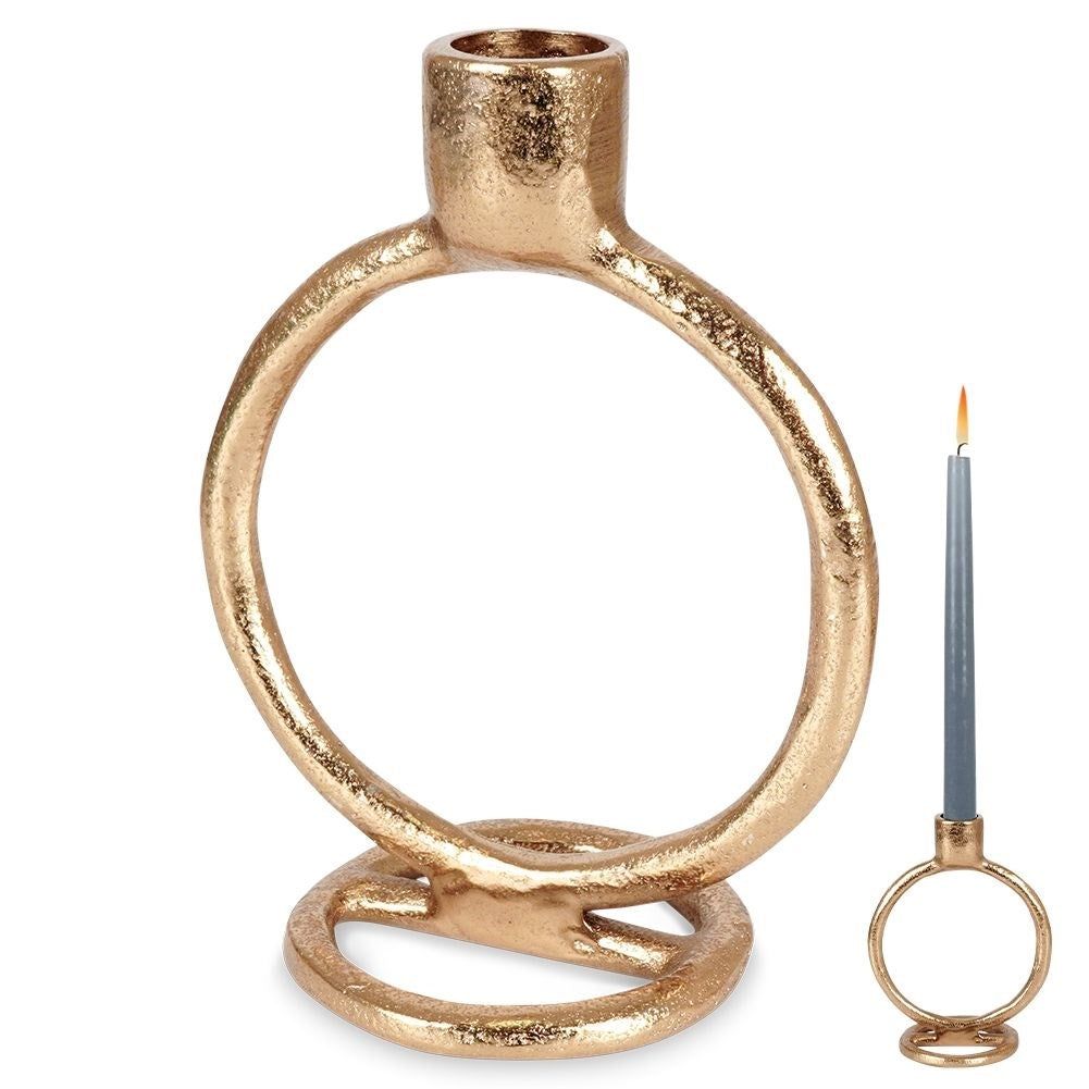 Elegant golden candlestick in classic style for long candles