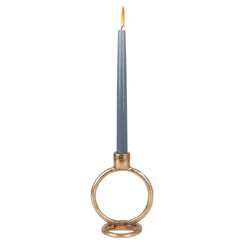 Elegant golden candlestick in classic style for long candles