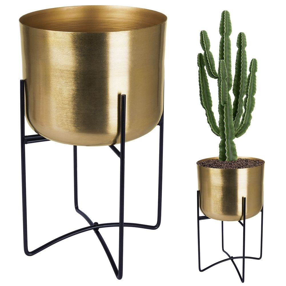 Elegant gold flower pot on black metal stand for modern interior design
