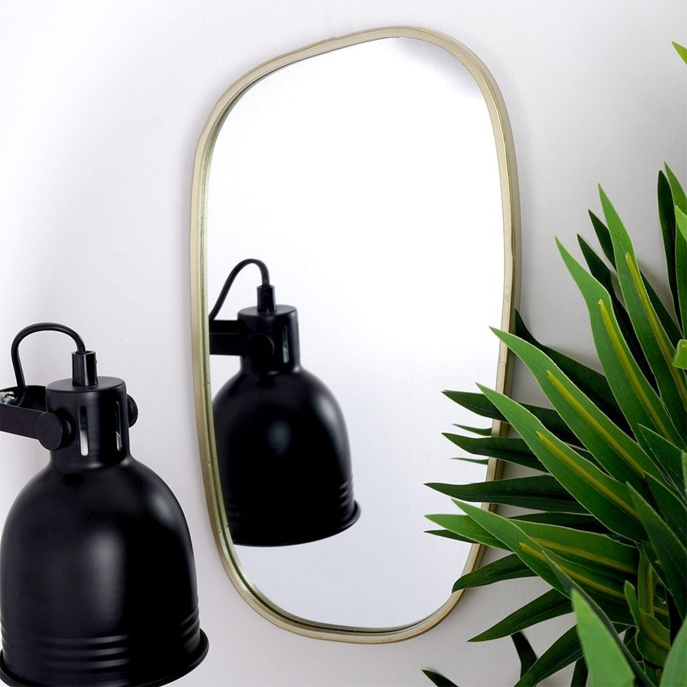 Elegant irregular wall mirror with golden metal frame