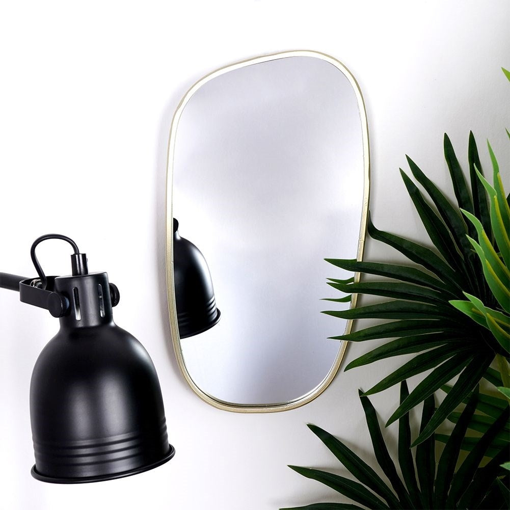 Elegant irregular wall mirror with golden metal frame