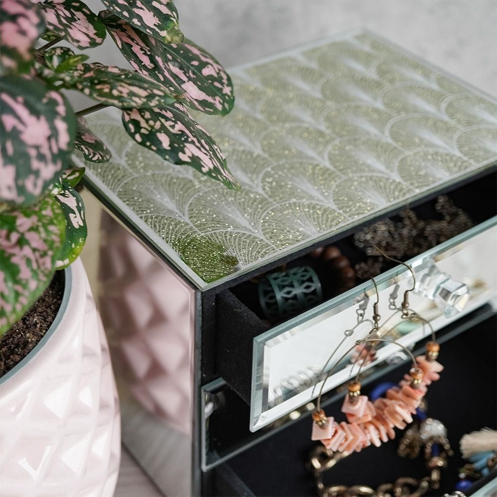 Elegant jewelry box with three drawers and crystal handle
