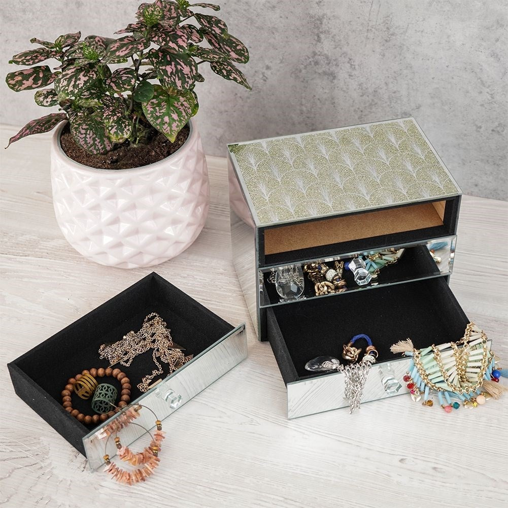 Elegant jewelry box with three drawers and crystal handle