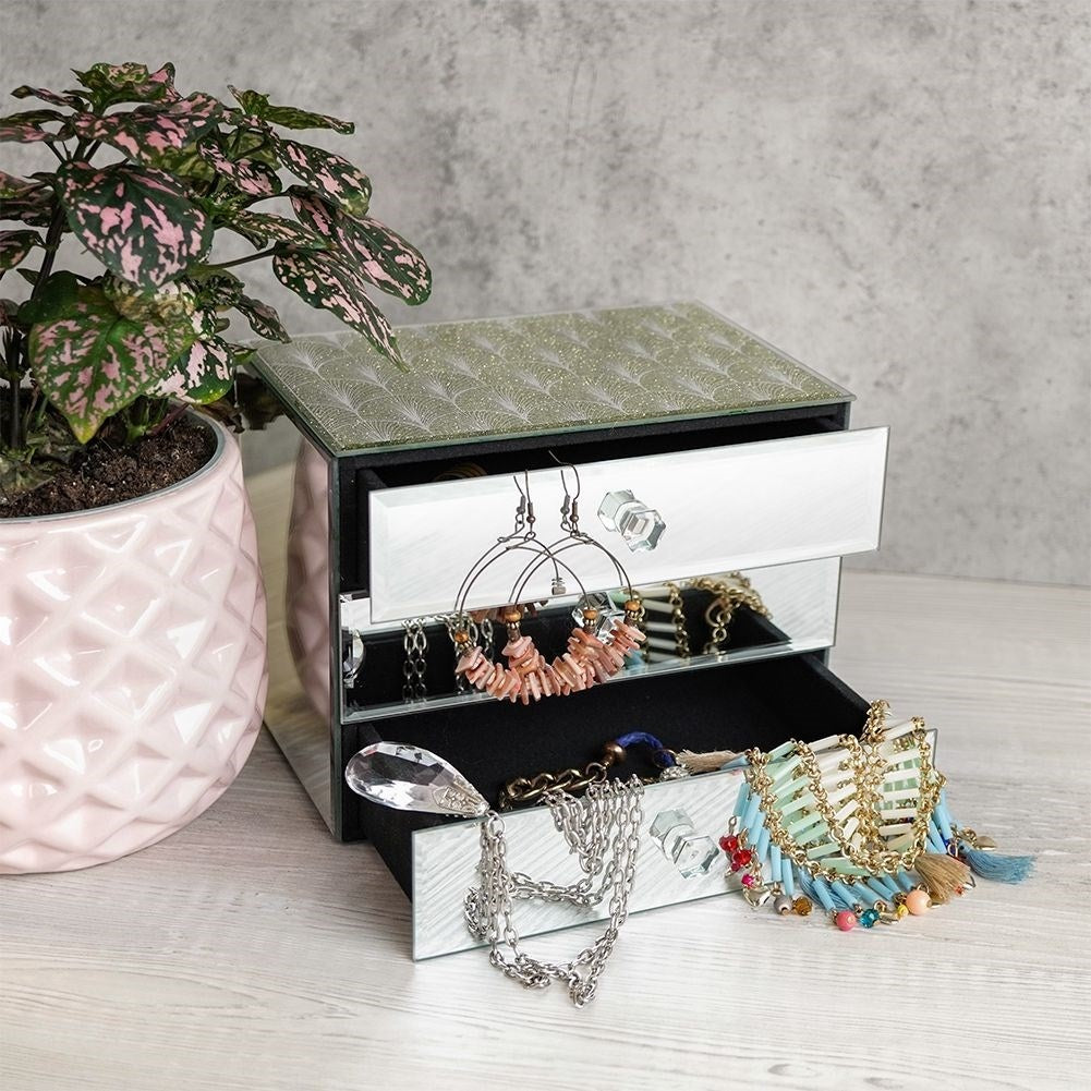 Elegant jewelry box with three drawers and crystal handle